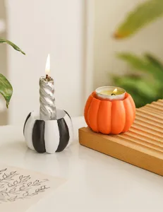 Resin pumpkin candle holder detail, perfect Halloween holiday table decoration setup.