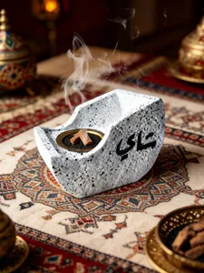 Creative resin boat-shaped incense burner with Arabic calligraphy, perfect for home decor.