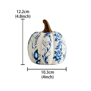 Blue and white ceramic pumpkin ornament, elegant floral pattern, home desktop decor item.