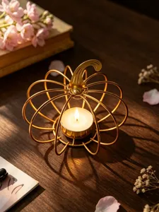Iron pumpkin candle holder detail view, perfect for romantic dining table and autumn home decor.