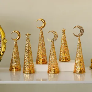 Gold metal cone candle holders set with crescent moon star decor for holiday wedding party table.