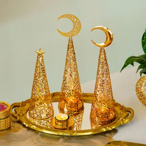 Gold metal hollow Christmas tree candle holder set with moon star toppers and mirror tray decor.