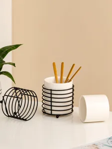 Ceramic tableware storage holder set with metal wire rack and golden spoons for desktop organization.