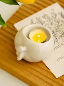 Creative ceramic tealight candle holder cute mini candle cup for home desktop decor.