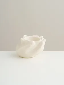 Ceramic hand shaped candle holder detail, minimalist creative home tabletop decor ornament.