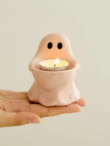 Cute pink ceramic ghost candle holder for home decor, creative desktop tea light candle cup.