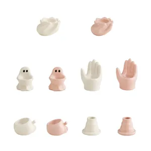 Cute ceramic candle holders set, creative ghost hand and fruit shapes for home decor.