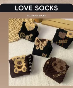 Plush fuzzy bear winter socks, cute black mid-tube thermal hosiery for women, cozy casual daily wear.