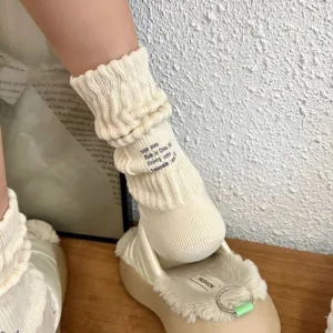 Japanese tooling style knitted stackable cotton socks with letter print, detail shot.