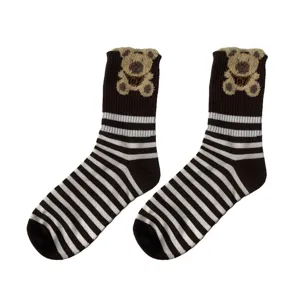 Cozy winter women's mid-tube socks with cute plush teddy bear and classic black white stripes.