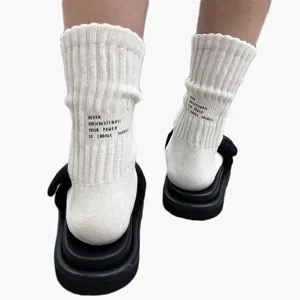 White ribbed crew socks with motivational text print, comfortable cotton style, perfect cityboy look.