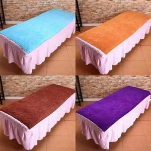 Coral fleece massage bed cover with pink ruffled skirt, spa beauty salon table cover variant.