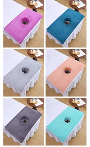 Detailed view of thick coral fleece beauty salon massage bed cover towel with face breath hole.