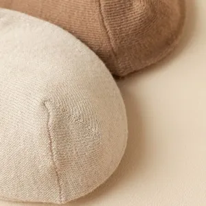 Solid color knit socks close up showing fine texture, breathable daily cotton blend socks.