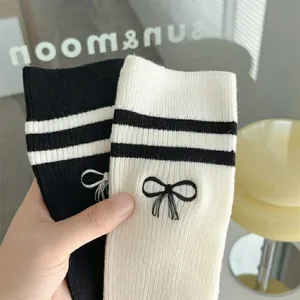 JK style Lolita bow calf socks with double stripes and embroidery for women, daily wear.
