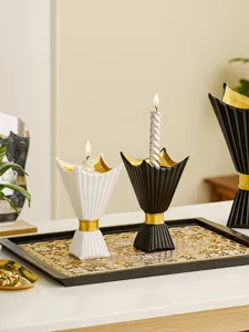 Middle Eastern horn chalice candle holder set with gold detail for home tabletop decor detail.