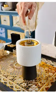 Close up detail shot of Middle Eastern Arabic style ceramic aromatherapy incense burner with smoke.