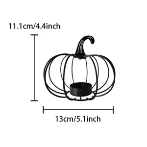 Detail view of black iron pumpkin candle holder showcasing dimensions and sturdy wire structure.