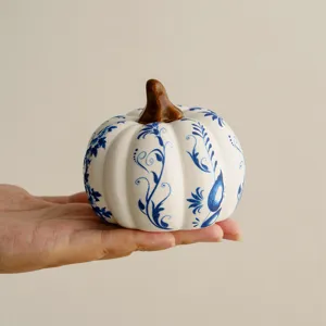 Ceramic blue and white porcelain pumpkin ornament for autumn tabletop home decoration.