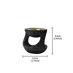 Dettaglio bruciatore di incenso in resina vaso appeso creativo moderno design maculato nero con ciotola.
