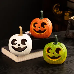 Halloween resin pumpkin ornaments, colorful spooky desktop decor for holiday harvest festival.