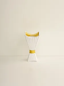 Middle Eastern style ceramic candle holder detail shot, elegant white and gold home decor.