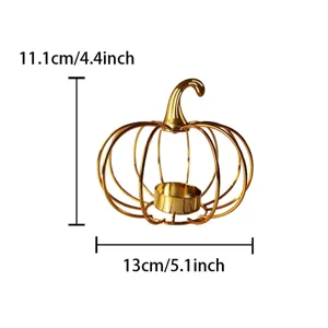 Golden iron pumpkin candle holder for Halloween home decor and dining table centerpiece display.