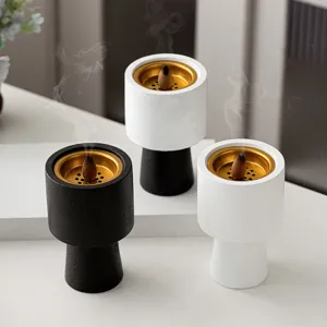 Modern ceramic incense burner with gold tray for home decor and aromatherapy relaxation.