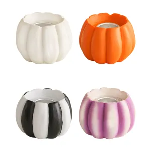 Halloween pumpkin resin candle holder set, cute autumn harvest home holiday decor tabletop.