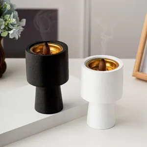Modern minimalist aromatherapy incense burner set, elegant black and white table censer for home.