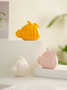 Ceramic pumpkin decor detail, modern minimalist tabletop ornament for home and office, harvest style.