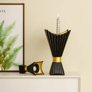 Middle Eastern style black and gold chalice candlestick holder set for elegant home desktop decor.