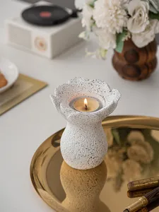 Close-up of the resin flower candle holder showing exquisite texture and warm candlelight ambience.