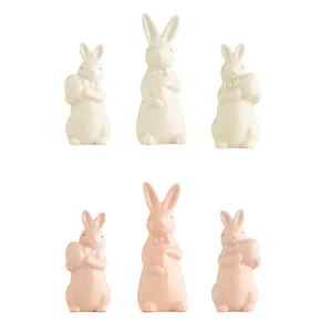 Easter ceramic bunny figurines set, cute bow tie animal tabletop decor for home interior.