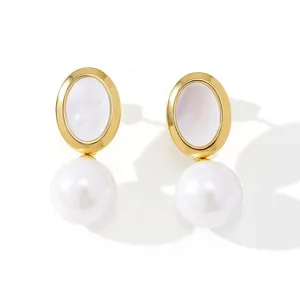 Elegant gold-rimmed mother-of-pearl stud earrings with chic dangling white pearl drops