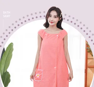 Detailed showcase of soft pink waffle fleece wearable bath skirt featuring daisy embroidery.