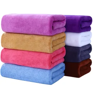 Multi-color microfiber bath towels folded neatly in stack, soft and absorbent for daily use.