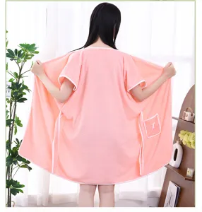 Coral fleece wearable bath towel detail, soft and absorbent pink spa wrap skirt with pocket.