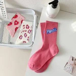 Cute pink and white mid-tube socks with cute knit patterns for women daily wear spring.