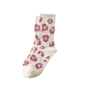 Cute pink and blue floral mid-calf socks for women, sweet Japanese style cotton daily wear.