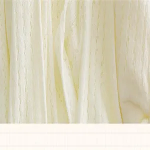 Close up of breathable mesh white sock fabric, showing soft knitted texture detail.