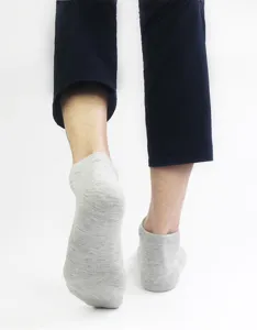 Detail view of grey solid ankle socks for men and women, breathable spring/summer wear.
