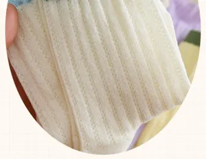 White mesh breathable solid color mid tube socks close up texture detail summer thin style