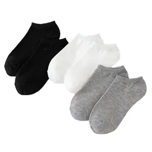Comfortable solid color short ankle socks for men and women in black white and grey.