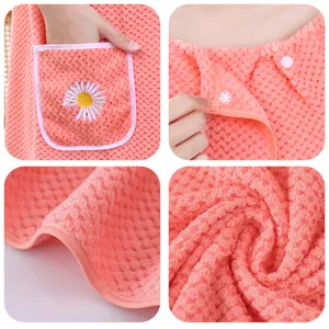 Coral velvet wearable bath towel dress with pockets and snap buttons, soft and cozy main view.