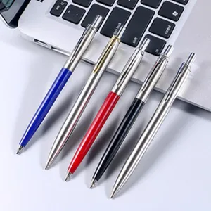 Metal retractable ballpoint pen detail shot, smooth writing metallic barrel office gift.