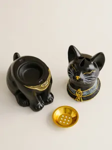 Detailed view of Egyptian cat incense burner, black gold finish, elegant home decor accent.