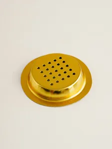 Gold censer mesh gasket iron accessory detailed shot showing fine perforated design and texture.