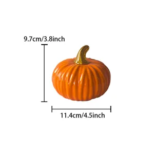 Ceramic pumpkin figurine with gold stem, fine petal detail, autumn tabletop home decor.