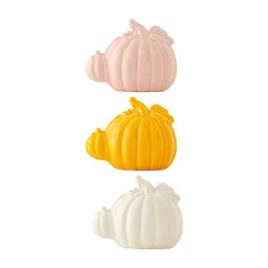 Ceramic pumpkin decor set, 3 pieces pink yellow white tabletop home autumn harvest display.